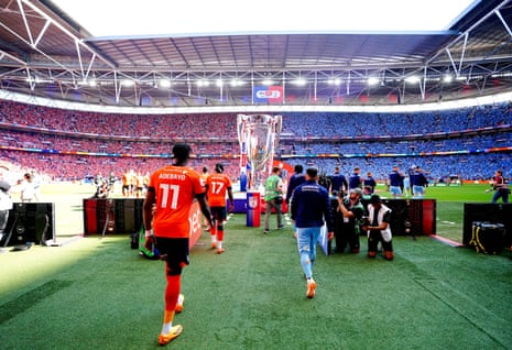 Coventry City and Luton Town players make their way out onto the pitch ahead of the Sky Bet Championship play-off final at Wembley Stadium.