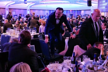 Dan Scavino jumps over a chair after the incident at the annual White House Correspondents Association Dinner 25 April, 2026 in Washington, DC.