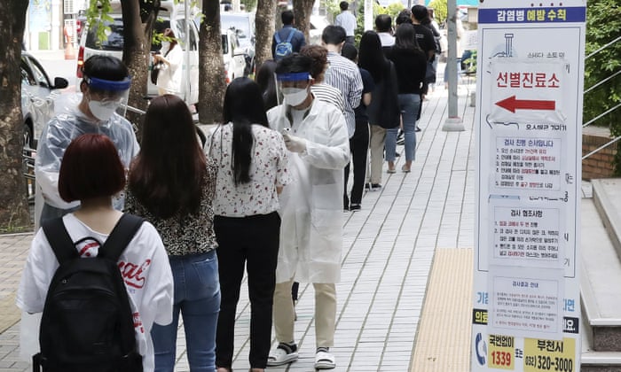 People suspected of being infected with coronavirus wait for a test Bucheon, South Korea, on Thursday 28 May 2020