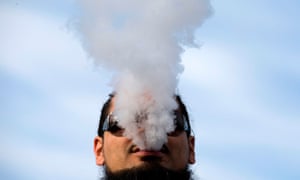 A demonstrator vapes during a rally outside of the White House to protest the proposed vaping flavor ban in Washington DC on 9 November 2019.