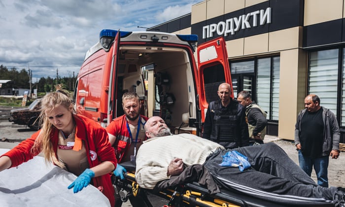 A sick man is evacuated in Raihorodok, Ukrain on May 22 2022.