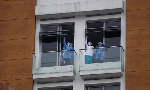 Nurses from a hospital wave during demonstrations in Bogotá, Colombia, on 3 May.
