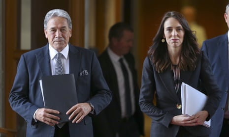 New Zealand Prime Minister Jacinda Ardern, right, walks with Deputy Prime Minister Winston Peters 