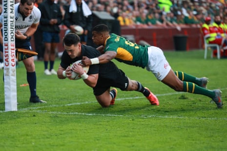 New Zealand's wing Will Jordan dives to score a try.
