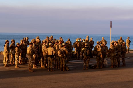 California National Guard personnel gather during the Palisades Fire near the Pacific Palisades neighborhood in Los Angeles, California, U.S. January 11, 2025.
