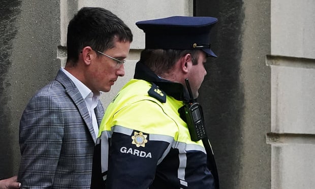 Enoch Burke with police officer