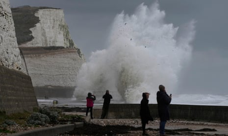 Waves crash over the harbour wall in Newhaven, England.