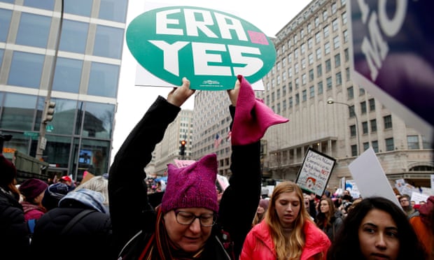 A demonstrator holds a sign supporting the Equal Rights Amendment during the Women’s March in Washington DC, on 19 January 2019.