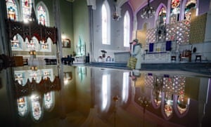 A woman collects an envelope of ashes at Carlow Cathedral in Co Carlow, Ireland. The Catholic church has urged people to celebrate Ash Wednesday at home