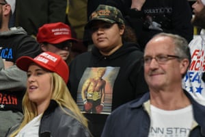 A Trump fan sports a sweatshirt featuring a picture the president tweeted of himself photoshopped on to the body of Rocky Balboa