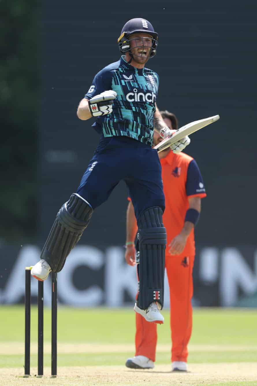 Phil Salt of England celebrates reaching his century.