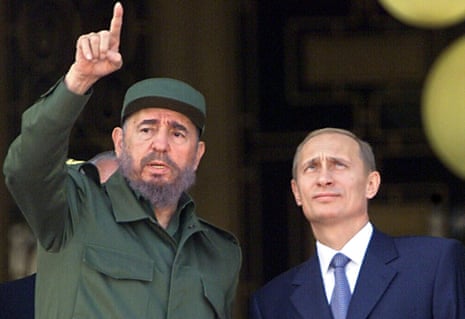 Castro gestures while he speaks to Russia’s president Vladimir Putin, 14 December 2000, at the Palace of the Revolution in Havana.