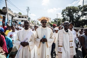 Catholic faithful demonstrate in a silent and non-violent march in Port-au-Prince against the Haitian government on October 22, 2019. - Thousands of Catholics demanding the resignation of Haiti’s president marched through the capital Tuesday, becoming the latest group to join an outcry against him. They gathered outside one of the main churches in Port-au-Prince and denounced President Jovenel Moise as corrupt and incompetent.