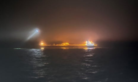 Night shot of vessel lit up on the sea