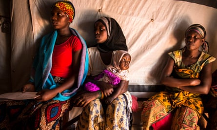 Women wait in the IRC women’s centre at the Nyarugusu refugee camp in Tanzania.
