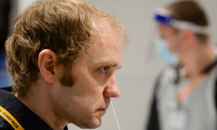 Test swab inserted into man's nose