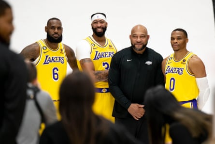 Darvin Ham poses with LeBron James (6), Anthony Davis (3) and Russell Westbrook (0) at LA Lakers media day in September 2022.