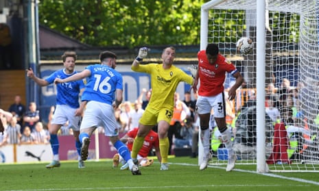 Jack Stretton of Stockport County scores his side's second goal to put them level in the tie against Salford City in the second leg of their EFL Sky Bet League Two play-off semi-final second leg.