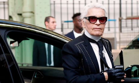 German fashion designer Karl Lagerfeld gets out of a car