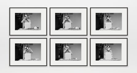 Six black and white images on a gallery wall.