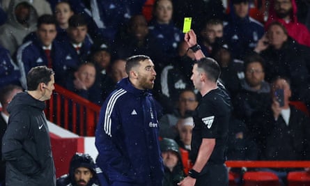Nottingham Forest’s substitute goalkeeper Matt Turner is booked by Michael Oliver