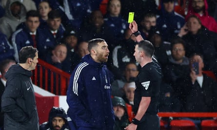 Nottingham Forest's substitute goalkeeper Matt Turner is booked by Michael Oliver