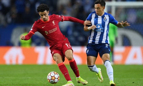 Curtis Jones holds off Porto’s Pepe during Liverpool’s 5-1 Champions League win on Tuesday.