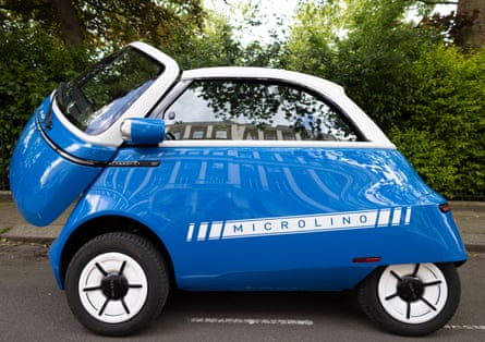 The Microlino car parked with its front door open