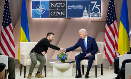 Joe Biden shakes the hand of Ukraine's President Volodymyr Zelenskyy during a meeting on the sidelines of the Nato summit in Washingtonon 11 July 2024.