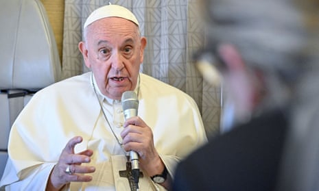 Pope Francis answers reporters' questions during a conference aboard the papal plane on his flight back to Rome after visiting Nur-Sultan, Kazakhstan, 15 September 2022.