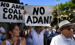 Environmental activists protest in Brisbane against Adani’s proposed Carmichael coal mine. Steve Ciobo blames activists for preventing Australia’s retail banks from financing ‘otherwise viable exporters in the coal sector’