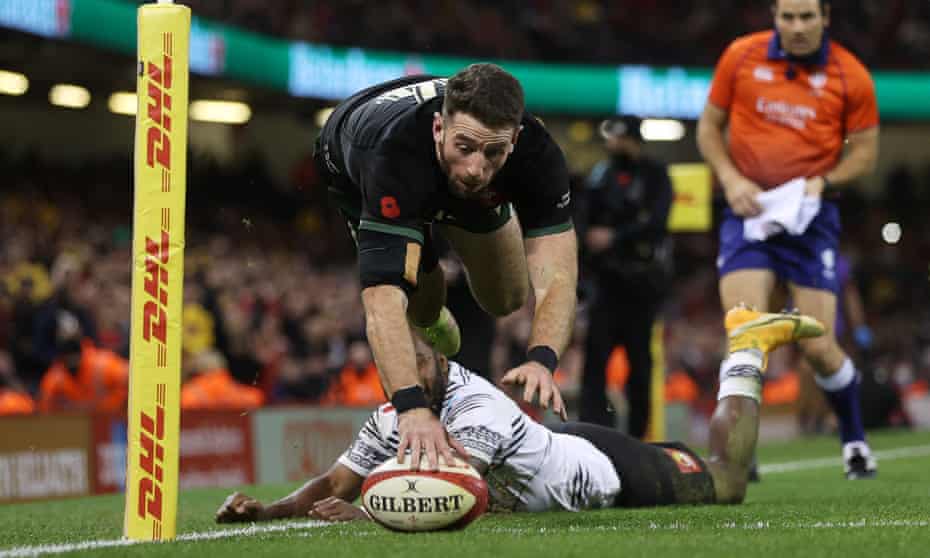 Alex Cuthbert dives over the line to score a try for Wales in their victory over Fiji