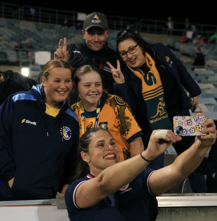Ilona Maher of the United States takes a selfie with fans.