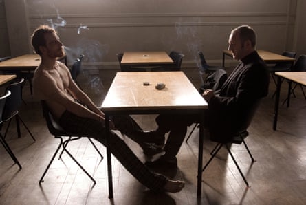 Michael Fassbender as Bobby Sands and Liam Cunningham as Father Dominic Moran in Hunger.