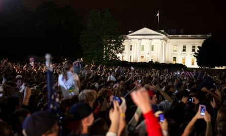 Crowds react to news of the raid outside the White House.