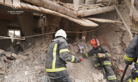 Rescuers work at a destroyed building in Lviv region 