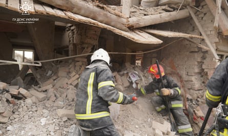 Rescuers work at a destroyed building in Lviv region
