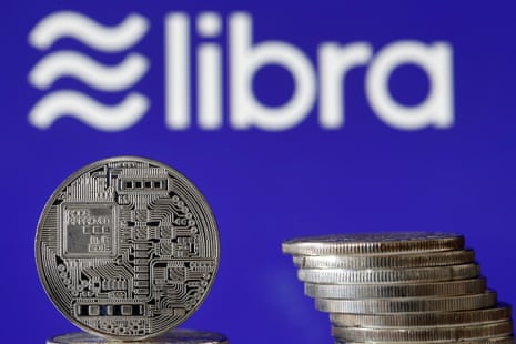 libra logo and physical coins on display in paris in june 2019