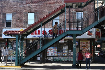 People walk up and down a staircase in East New York