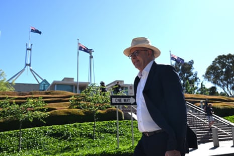 Anthony Albanese arrives walking to his office at Parliament House in Canberra on Friday.