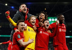 Jota joins his teammates in celebration after he scored in the penalty shootout to defeat Chelsea in the 2022 League Cup final