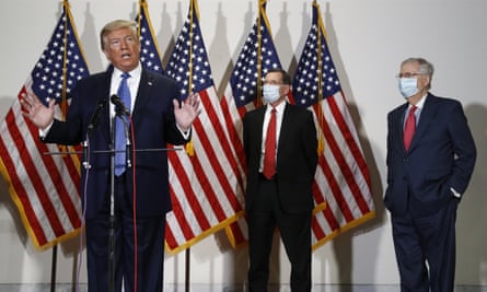Donald Trump speaks. Senators John Barrasso and Mitch McConnell wear masks.
