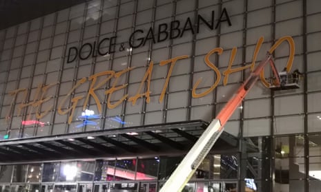 Workers take down the signage for Dolce &amp; Gabbana’s Great Show in Shanghai after it was postponed.