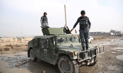 Staff members of Afghan security force inspect the blast site in Kabul, Afghanistan, on 29 November. Taliban militants organized a deadly car bomb attack in the Afghan capital on Wednesday night.