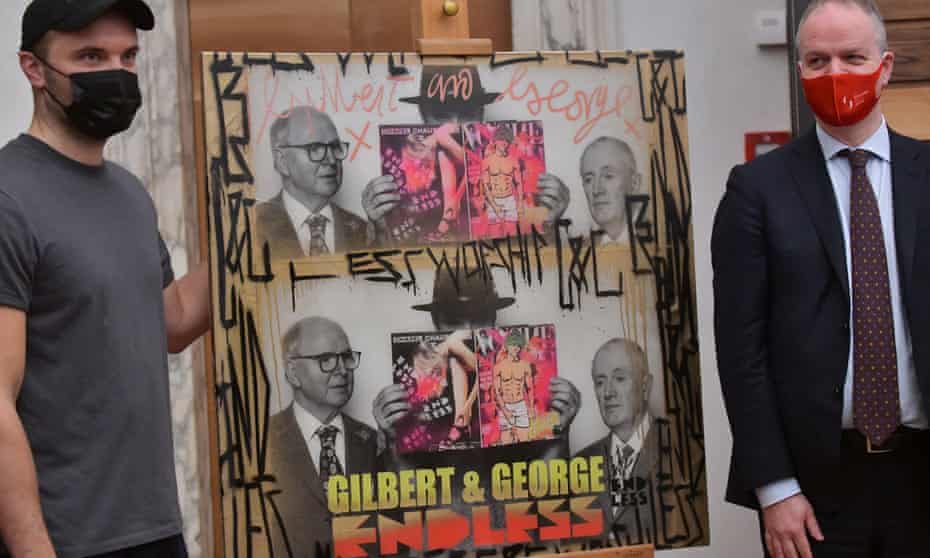 Endless, left, and the Uffizi director, Eike Schmidt, with the work the gallery has acquired from the street artist, which features his mentors Gilbert and George