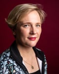 MP Stella Creasy, with short hair swept back and wearing a locket on a chain, smiles slightly