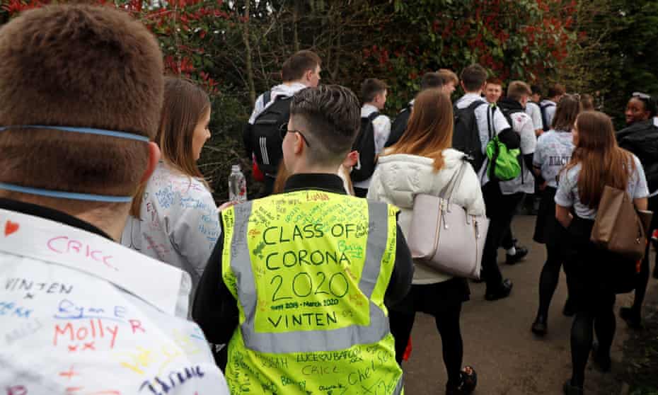 Year 11 pupils, some with graffiti-covered shirts, leaving school unexpectedly earlier this year as schools began to close