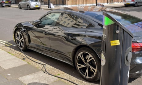 Electric car plugged into a charging point in London