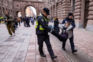 Greta Thunberg is carried away from a protest
