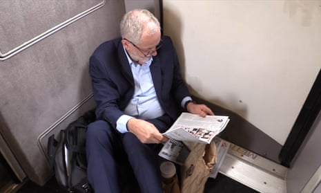 A still from the video of Jeremy Corbyn sitting on the floor of a train.